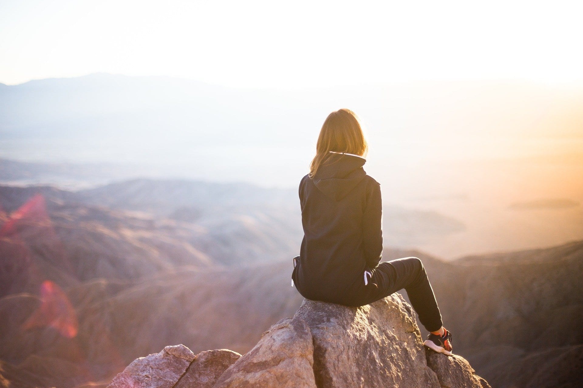 Woman looking out over mountains